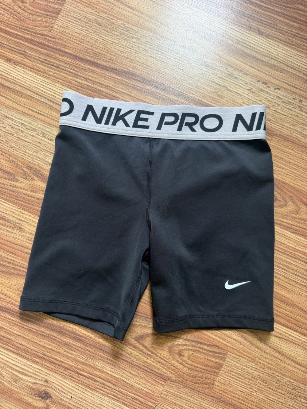 Nike Pro Black Kids Compression Shorts with light pink waistband